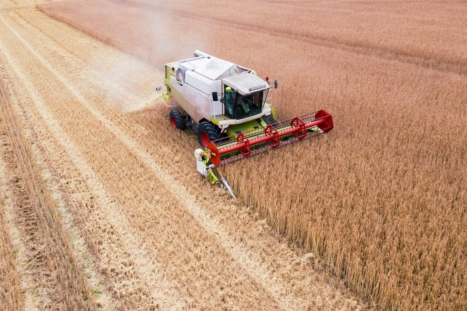 Combine harvester working in a field.